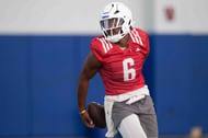 Kansas redshirt junior quarterback Jalon Daniels (6) passes the ball around his back. Source: Imagn